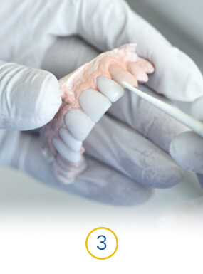 background hands with dental crowns in mexico