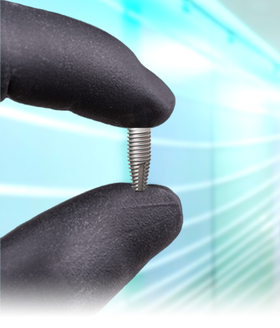 cancun dentist holding a titanium dental implant used in all on 4 procedure