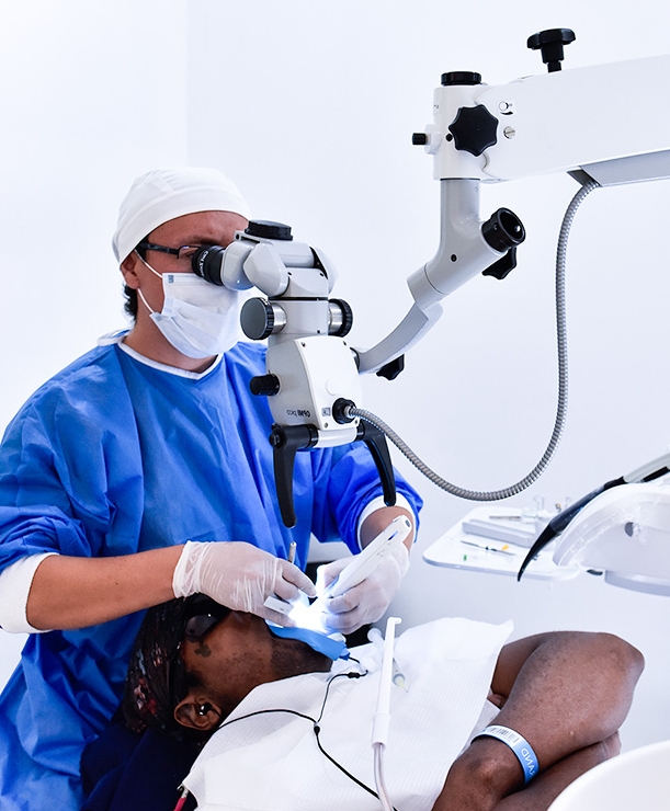 dentist at Ocean Dental Cancun performing general dentistry treatments on a patient