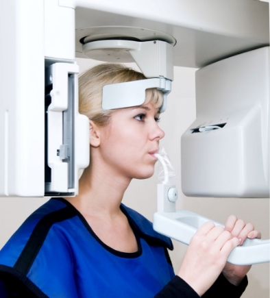 Young female patient at Cancun Dental Specialists undergoing a 3D Cone beam CT Scan