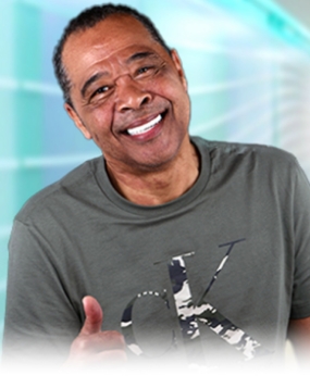 Black male patient of Dental Work Mexico showing his new smile