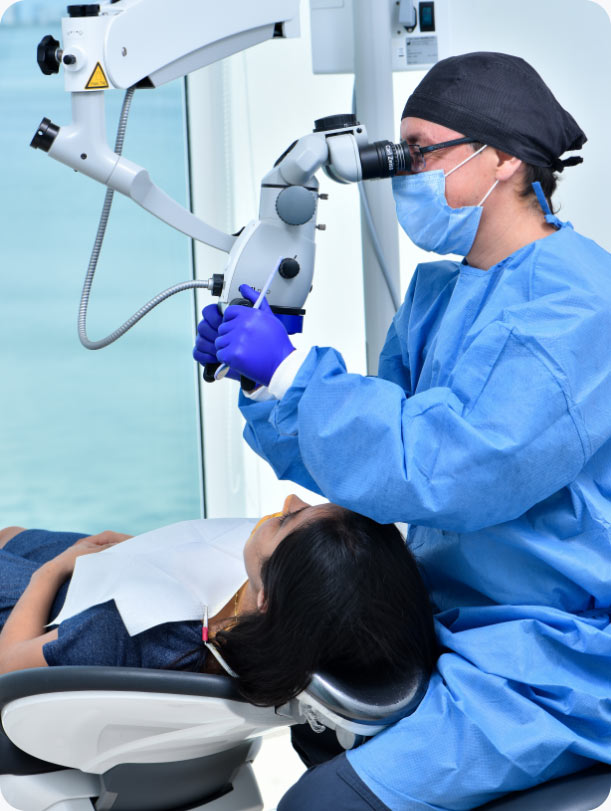 cancun dental specialist working on a female patient