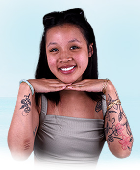 woman smiling after getting affordable dental crowns in mexico