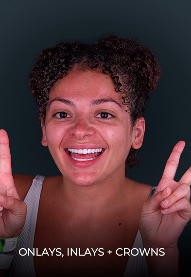 smiling after getting dental inlays and onlays in Mexico